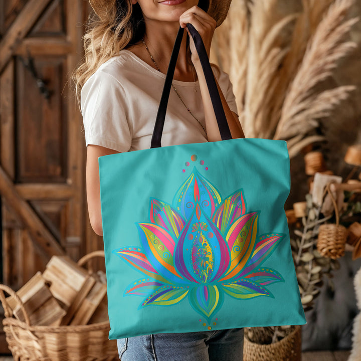 Front image of woman carying mandala lotus flower tote bag azure