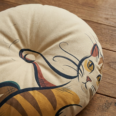 Dark Academia cat-themed round floor pillow in deep blackish brown tones with cream and mustard accents; a playful cat illustration sits on a cozy, bookish setting, lifestyle shot ideal for living room or study corner, showing warm comfort and curated vibes