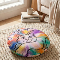 Winter cozy round floor pillow featuring a bright cat line-art design in blue (#0B5FFF) and warm accents; lifestyle shot showing the pillow in a cozy living room setting, with a playful, cuddly cat-inspired vibe.