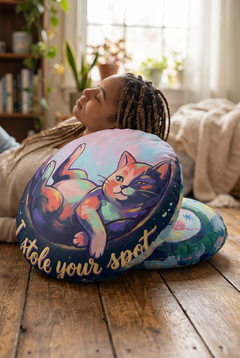 Round tufted floor pillow with a winter cozy cat design in navy background, Mint and coral fur accents, oil-paint style; lifestyle close-up showing a comfy seating corner.