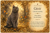 A decorative oracle card titled 'CAT COLOR ORACLE' with the color 'GRAY' and the phrase 'Calm & neutrality.' The left side shows a gray cat sitting in a sunlit autumn forest, while the right side contains text with an ornate gold border.