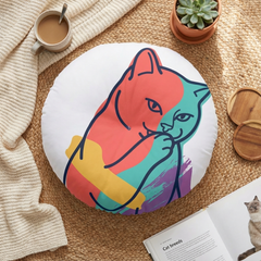 Round tufted cat floor pillow featuring sarcastic double-exposure line art in a simple cartoon style; color palette includes dark blue (#0B2340), pink (#FF6B6B), yellow (#FFD166), teal (#4ECDC4), purple (#7B2CBF); lifestyle setting on a sofa to convey cozy home decor, high-contrast lines emphasize attitude and depth.